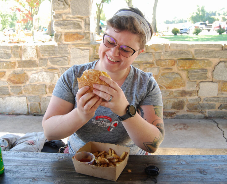 author enjoying burger