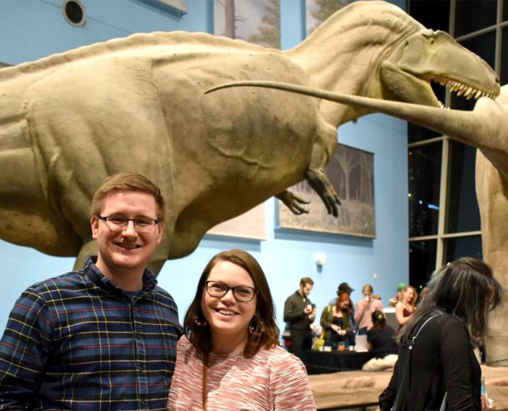 couple with dinosaurs