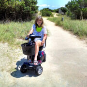 The author using her mobility scooter on one of her travels.
