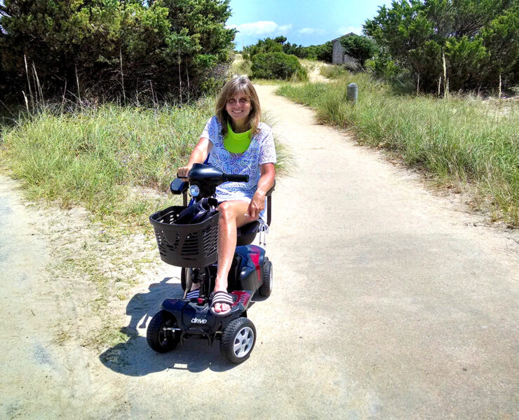 The author using her mobility scooter on one of her travels.