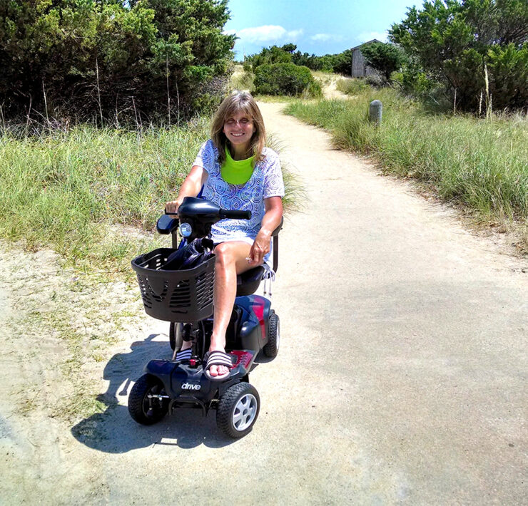 The author using her mobility scooter on one of her travels.