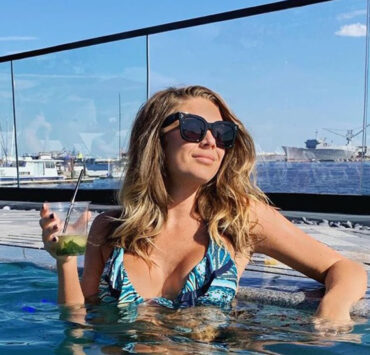 The outdoor pool at Sagamore Pendry overlooks the Inner Harbor in Baltimore, MD