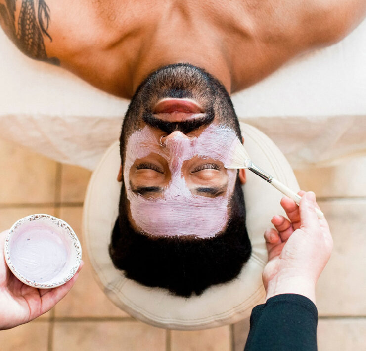 Man receiving a facial at The Spa at Turf Valley