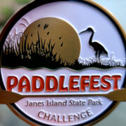 Paddlefest token/medal in writer's hand