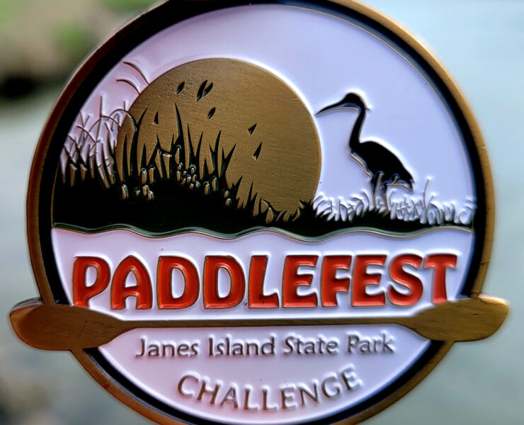 Paddlefest token/medal in writer's hand
