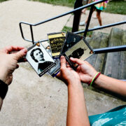 Children looking at National Park Service trading cards of people and places related to the Cara Barton National Historic Site