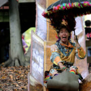 Festival goer sliding down a slide