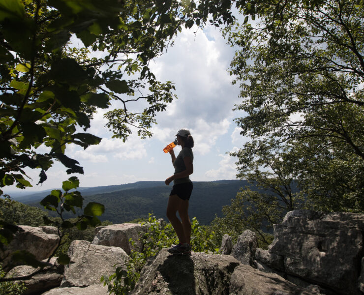 A hiker reaches the summit of Chimney Rock Trail in Catoctin Mountain Park