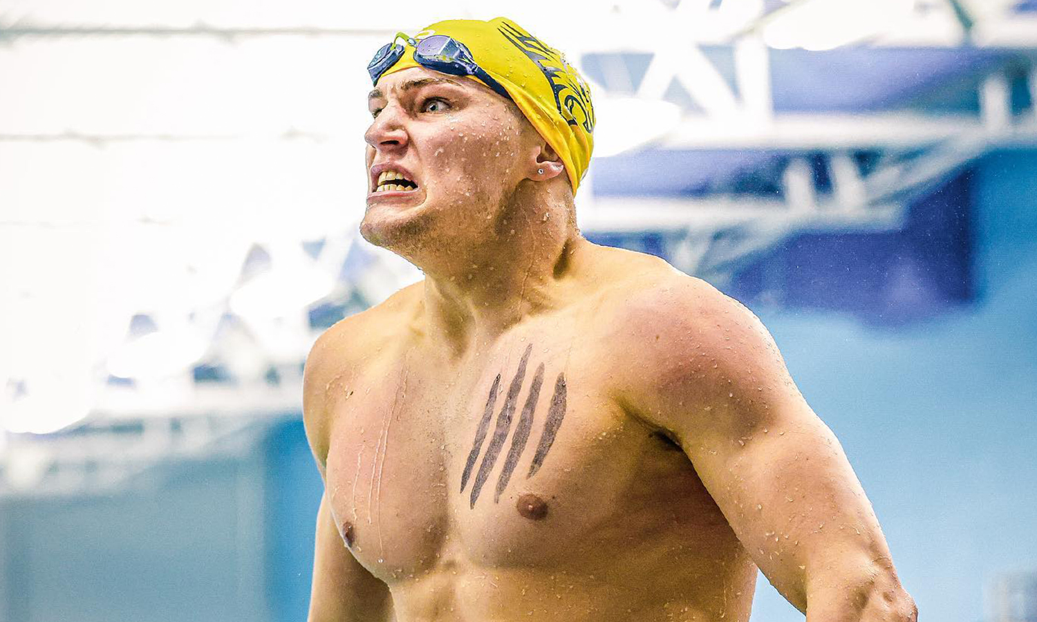 Swimmer in the middle of celebrating during a meet