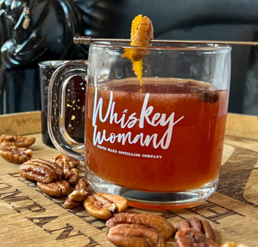Hot toddy cocktail on a barrel at a distillery