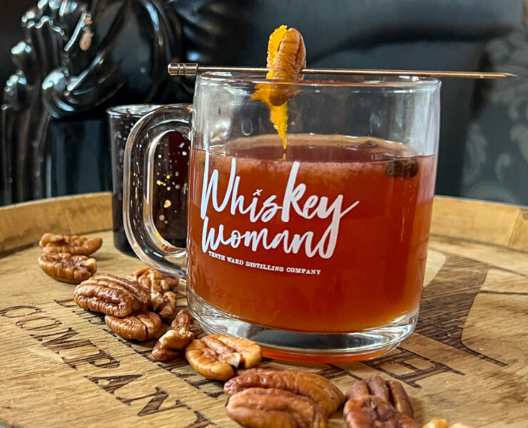Hot toddy cocktail on a barrel at a distillery