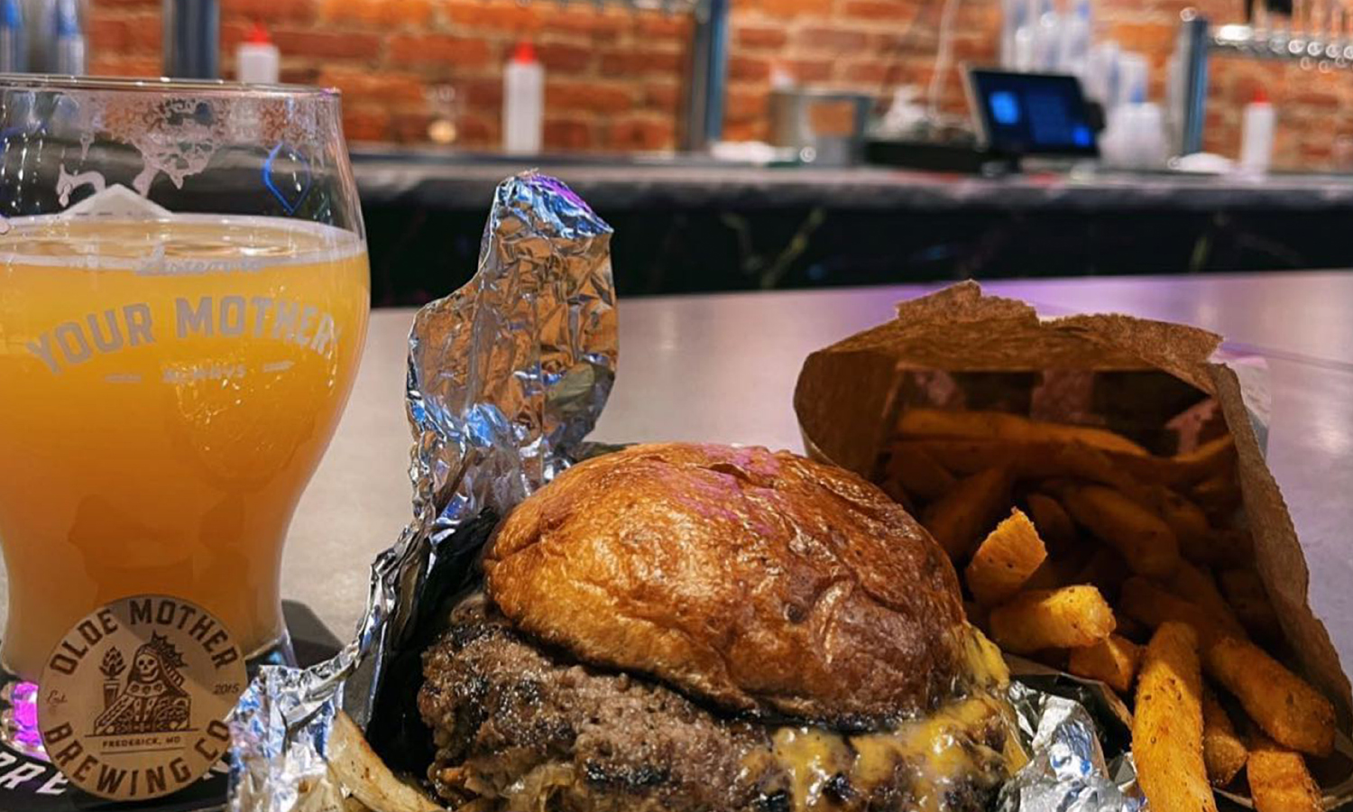 Beer, fries, and a burger at a brewery