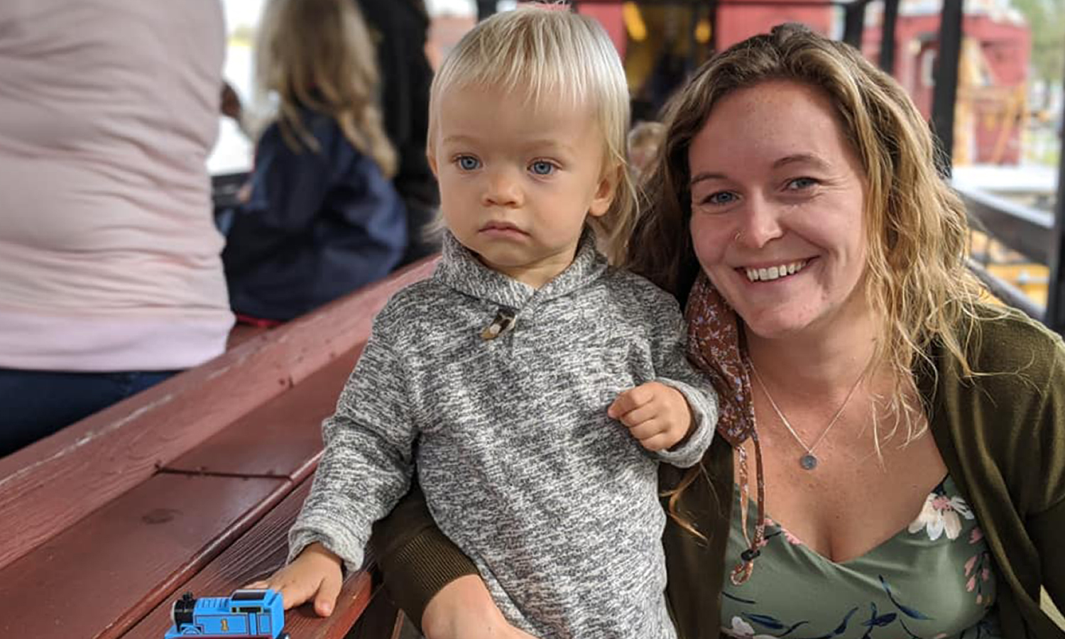 Mother and child enjoy train ride together
