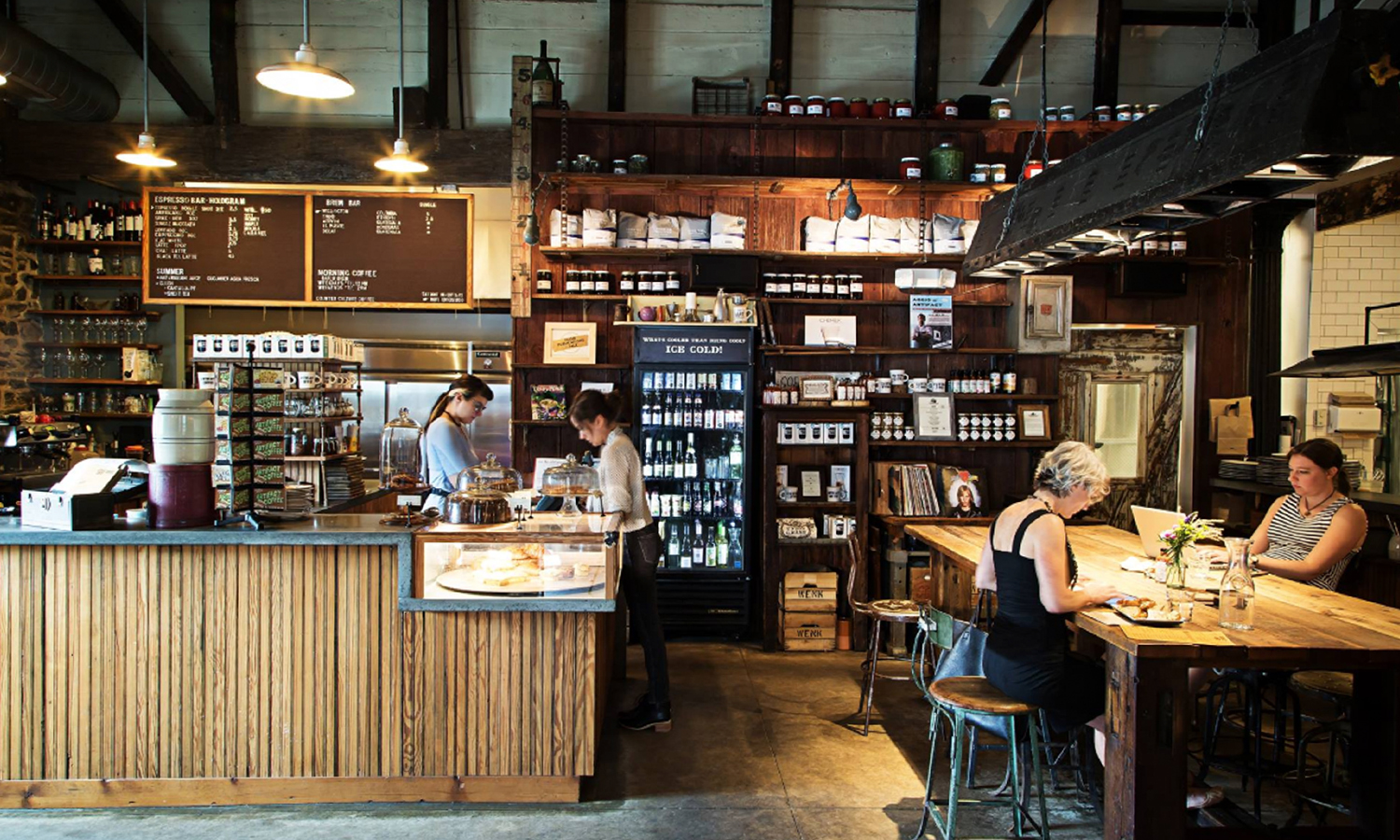 People working inside of a coffee shop