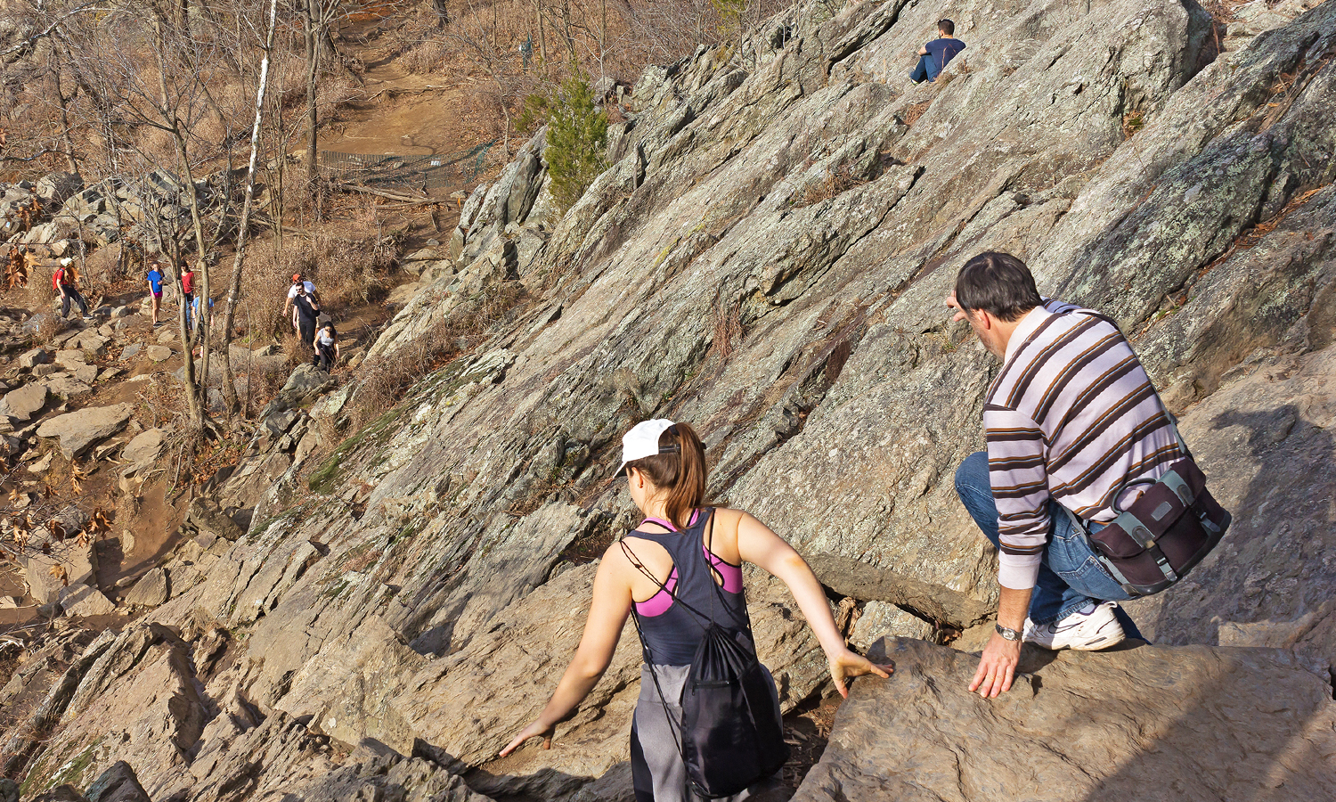 Hikers navigate difficult rock scramble