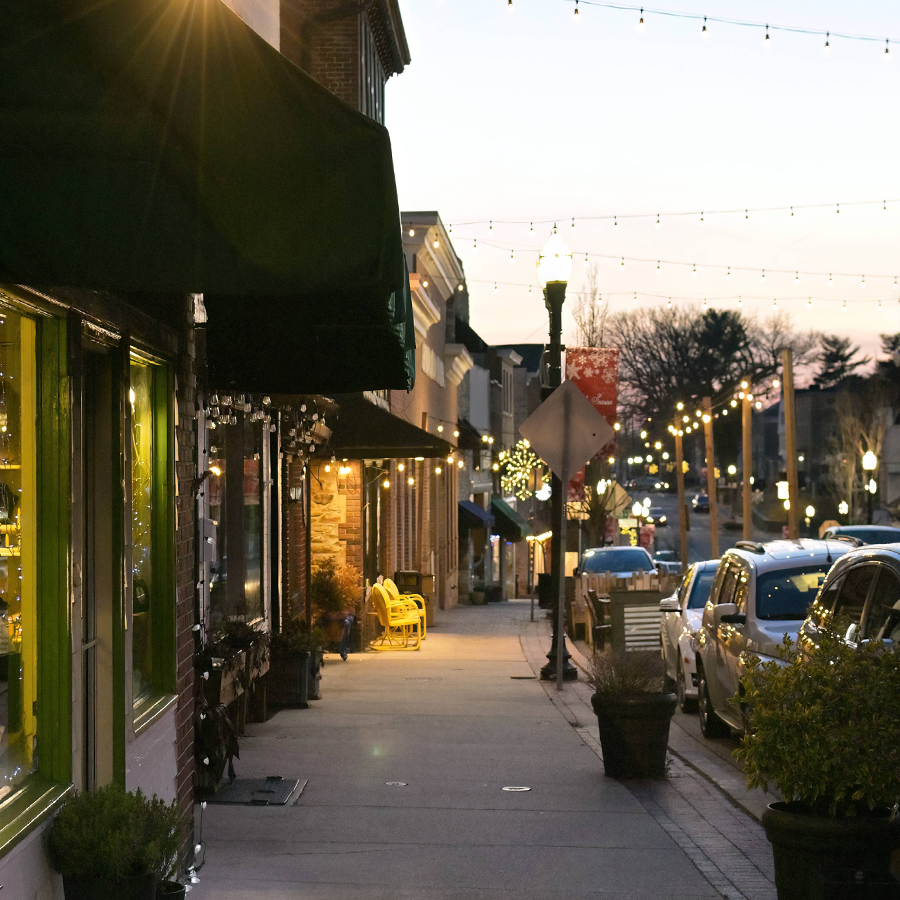 Nighttime downtown scene on a sidewalk