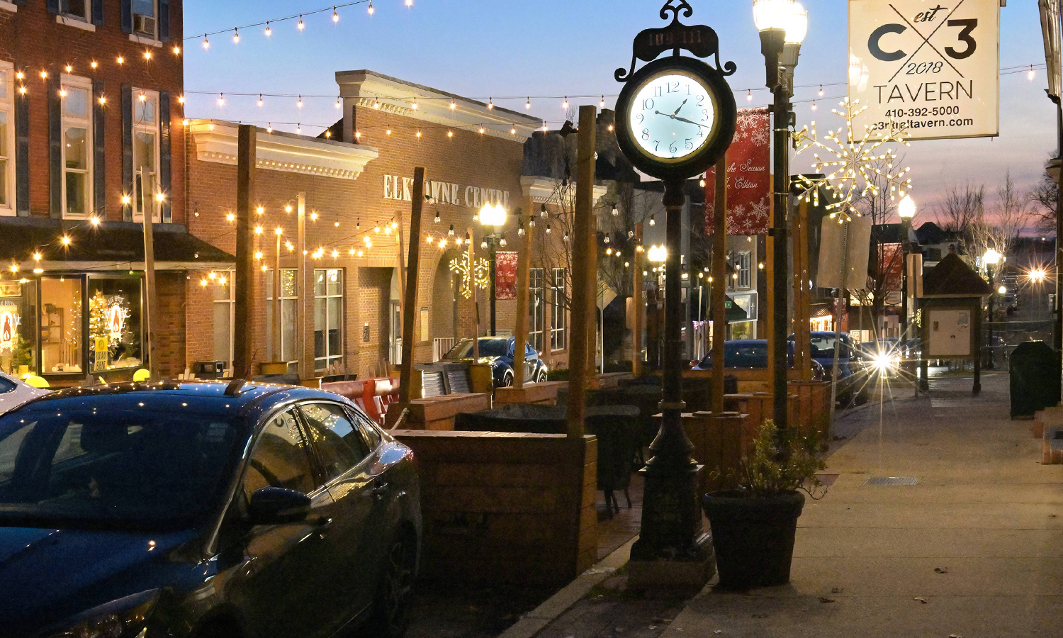 Nighttime downtown scene with festive lights