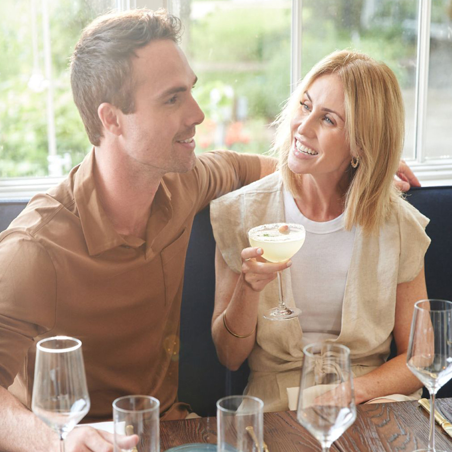 A couple enjoying drinks on a patio
