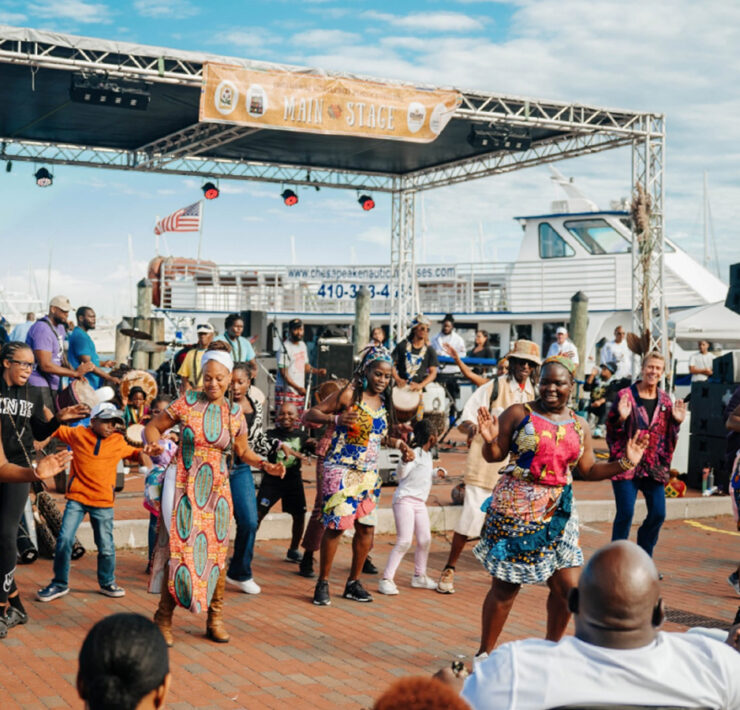 Huge crowd of people dancing in front of a stage