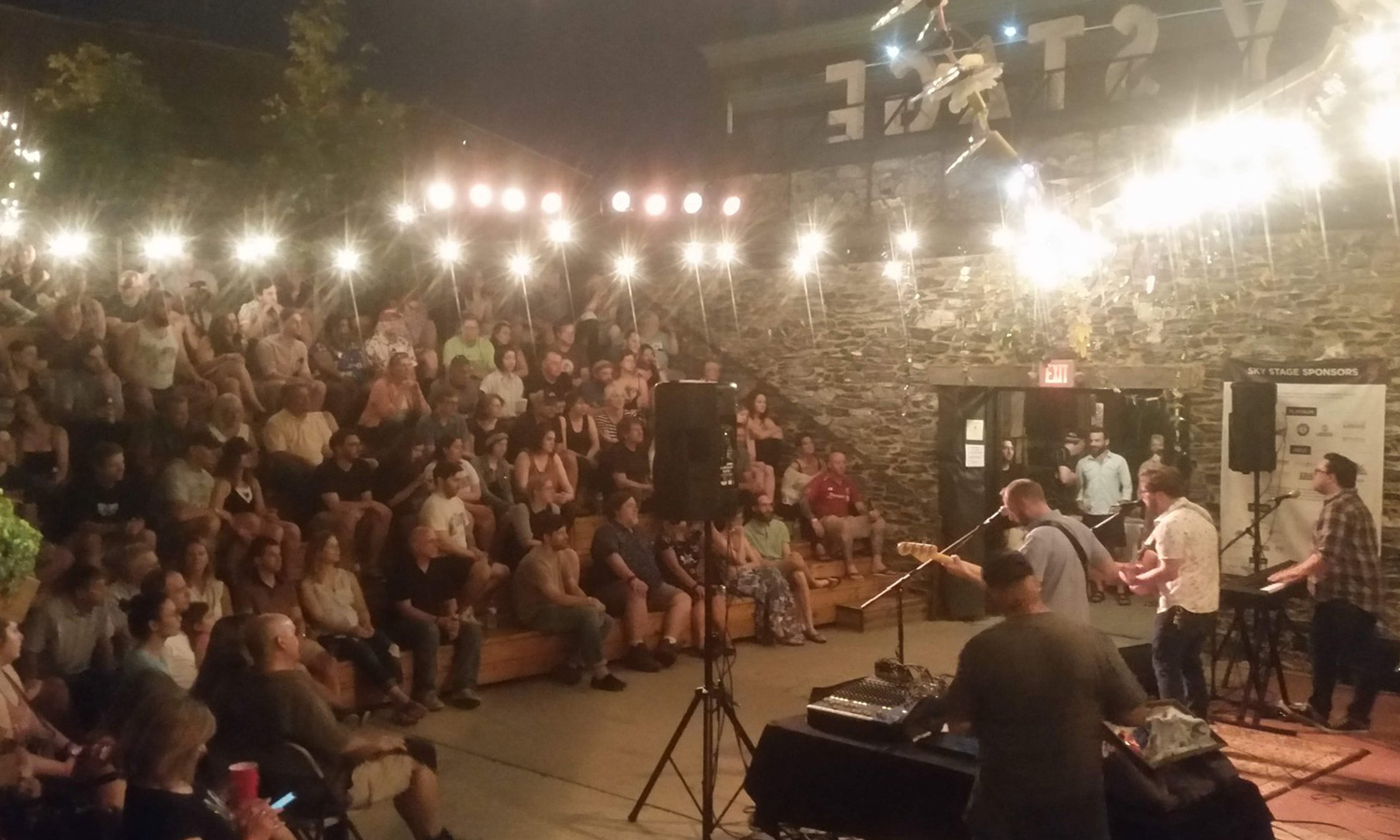 Band performing at intimate outdoor venue