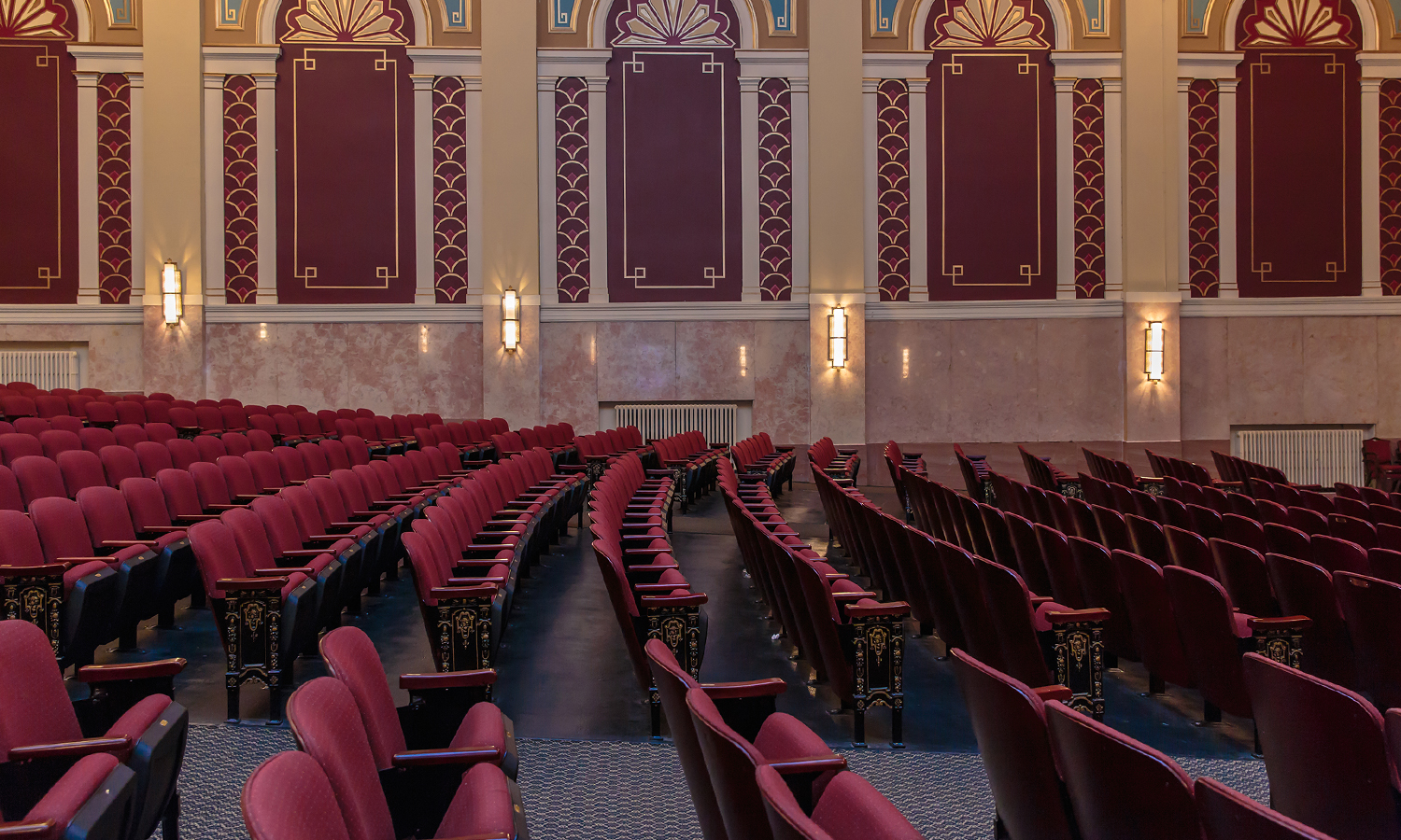 Inside of theatre with rows of empty seats